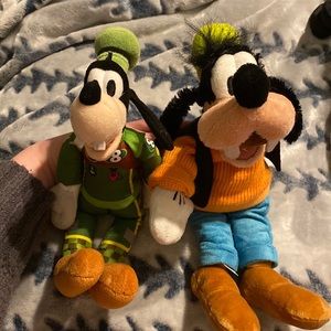 Two Disney goofy plushies.